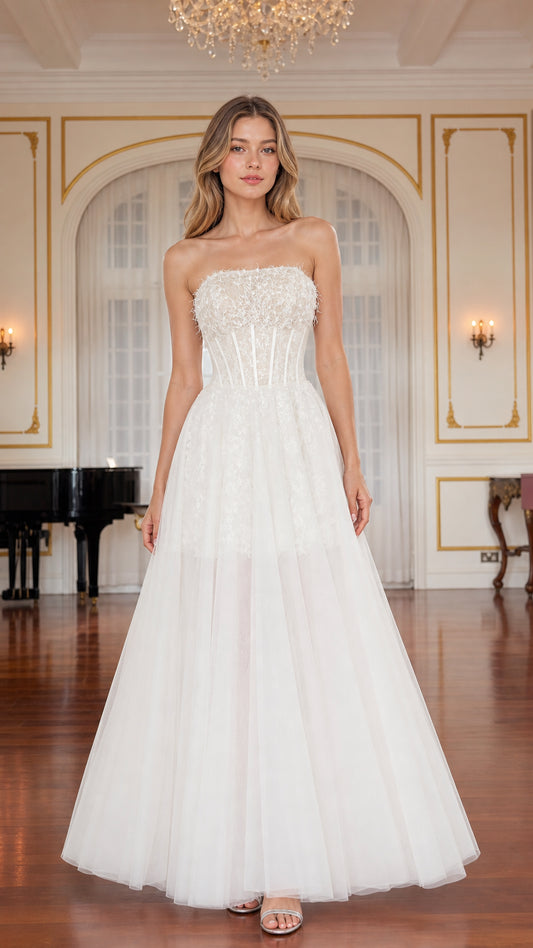 Front view of model wearing white strapless corset tulle A-line gown