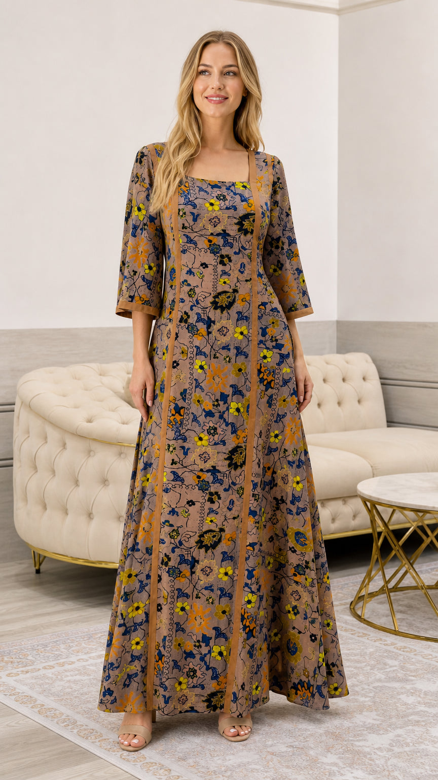 Front full view of woman wearing taupe floral square neck maxi dress with vertical piping