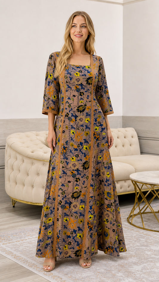 Front full view of woman wearing taupe floral square neck maxi dress with vertical piping