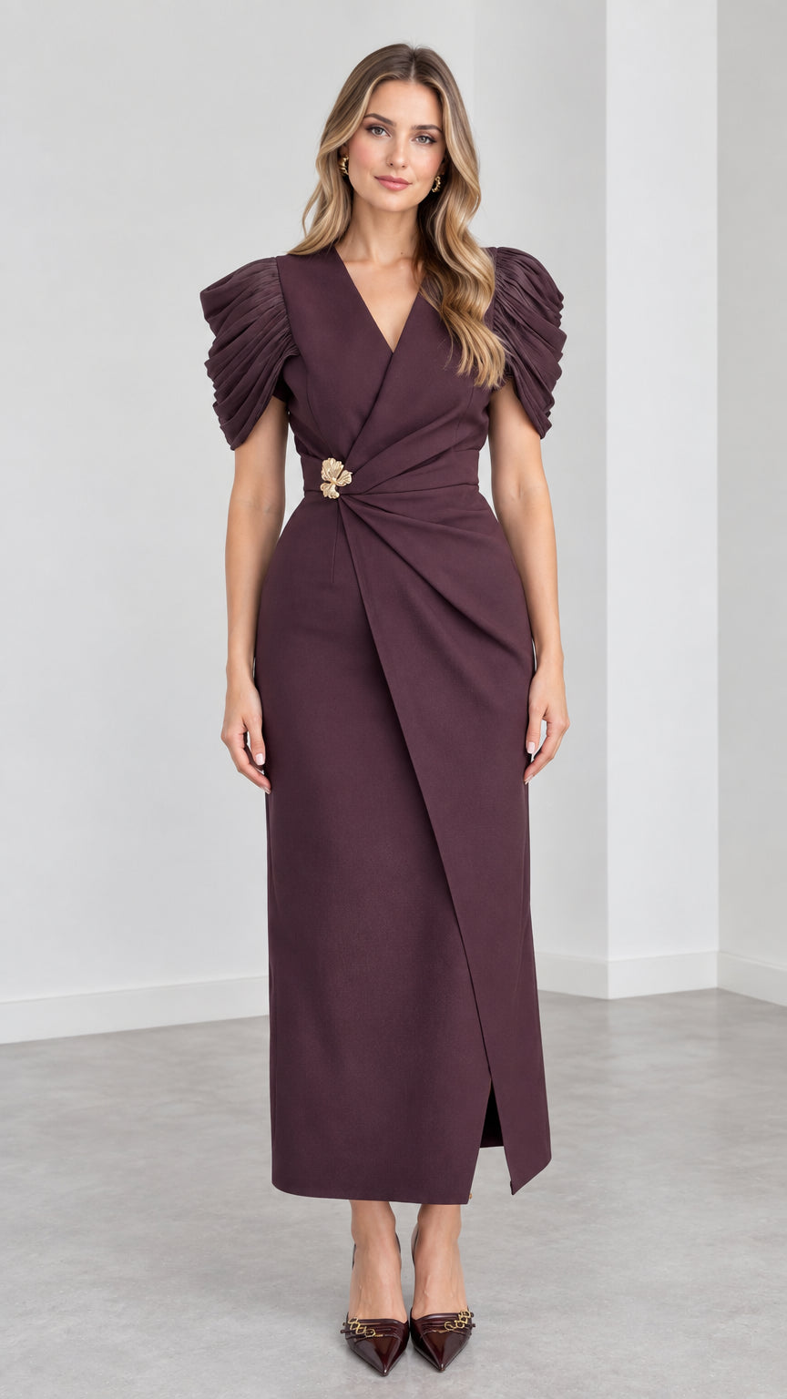 Front view of woman wearing Plum V-neck maxi dress with pleated cap sleeves and waist brooch