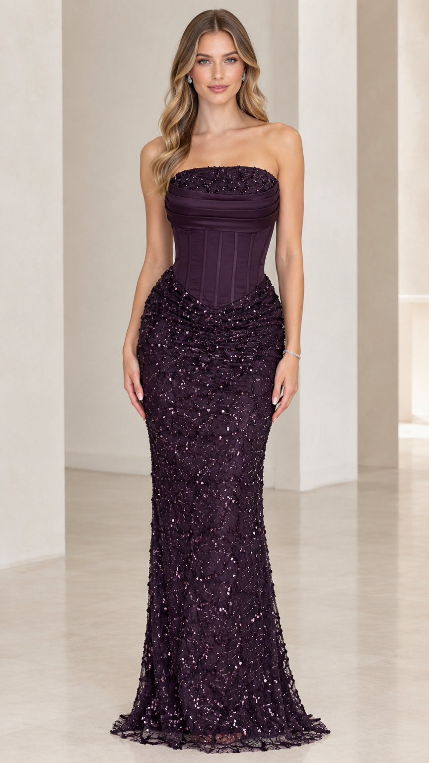Front view of woman wearing plum strapless corset sequin evening gown