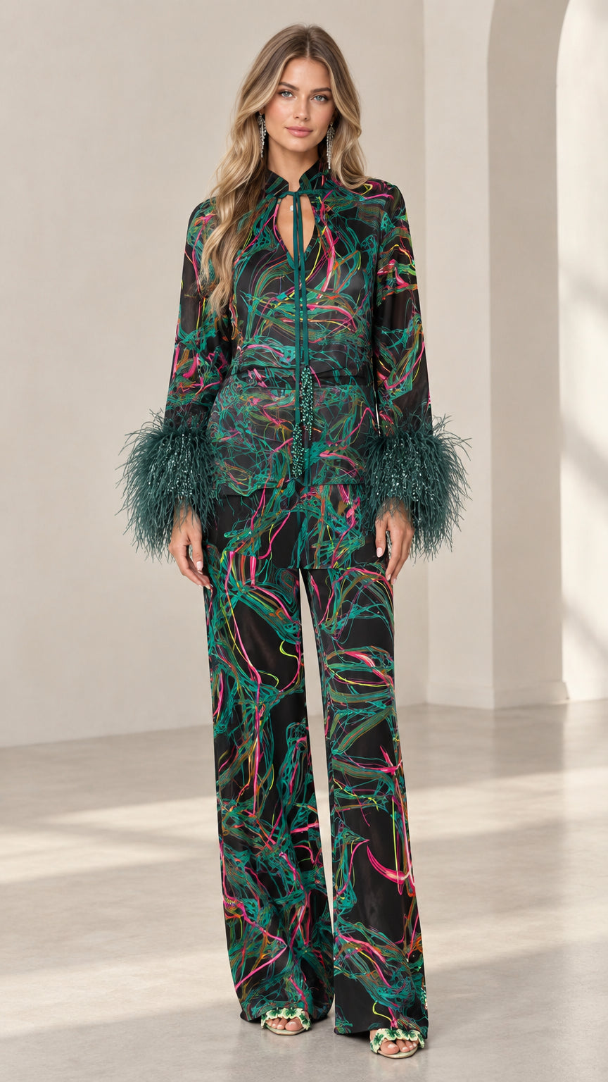 Front full-length view of model wearing Emerald Black feather cuff printed satin pant set