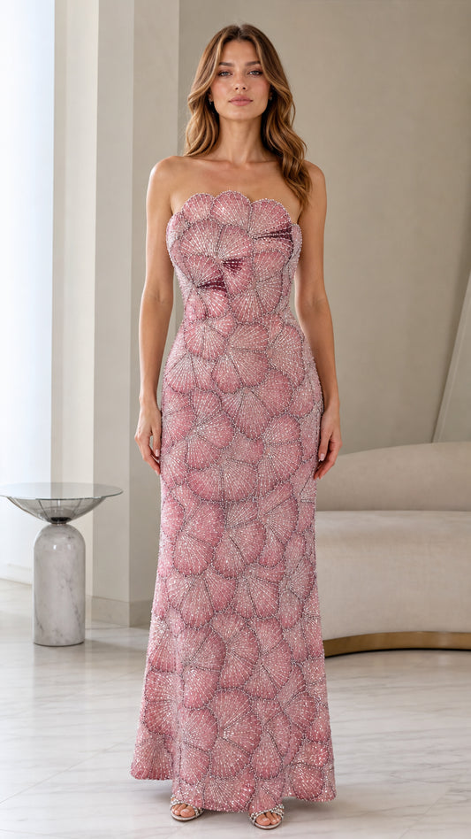 Front view of woman wearing strapless embellished dusty rose maxi evening gown