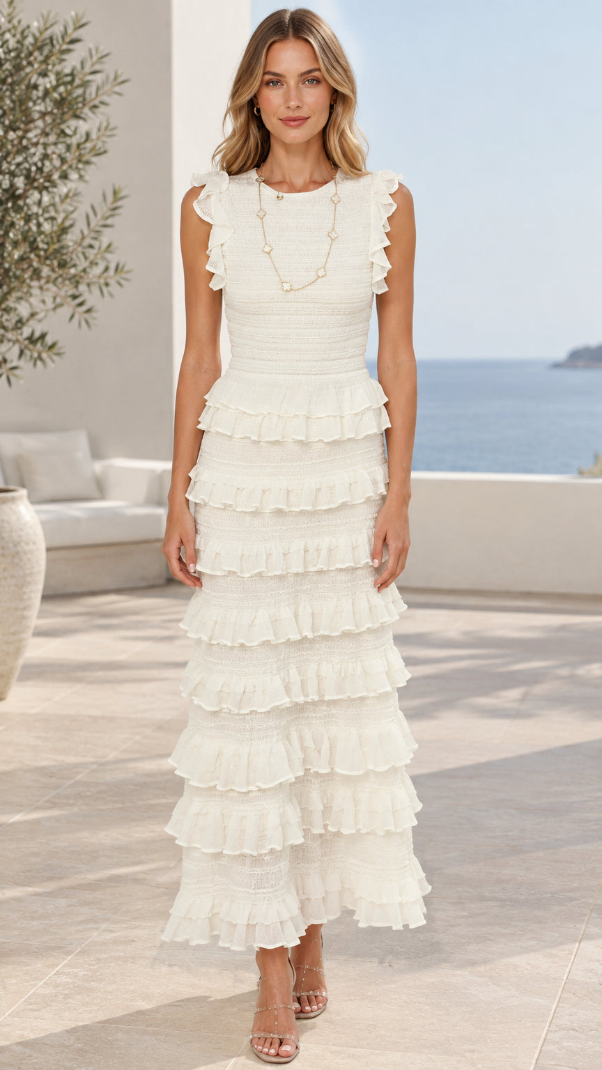 Front view of model wearing white sleeveless tiered ruffle maxi dress
