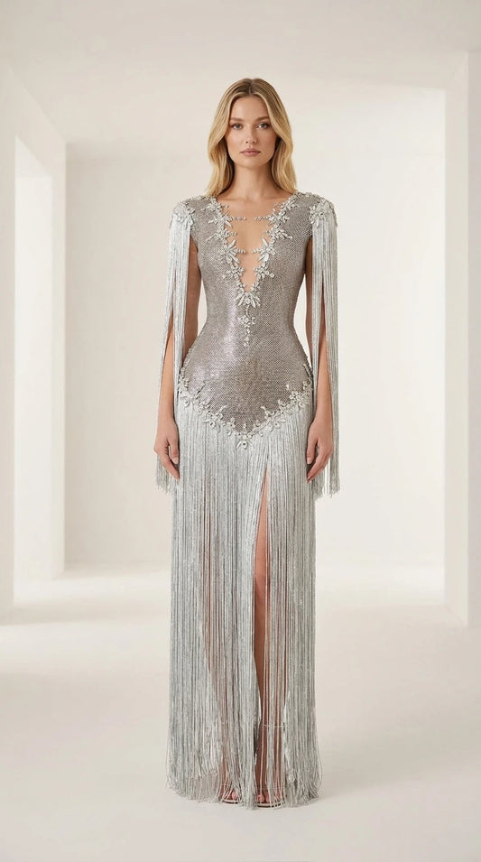 Front view of model wearing a silver crystal-embellished fringe evening gown