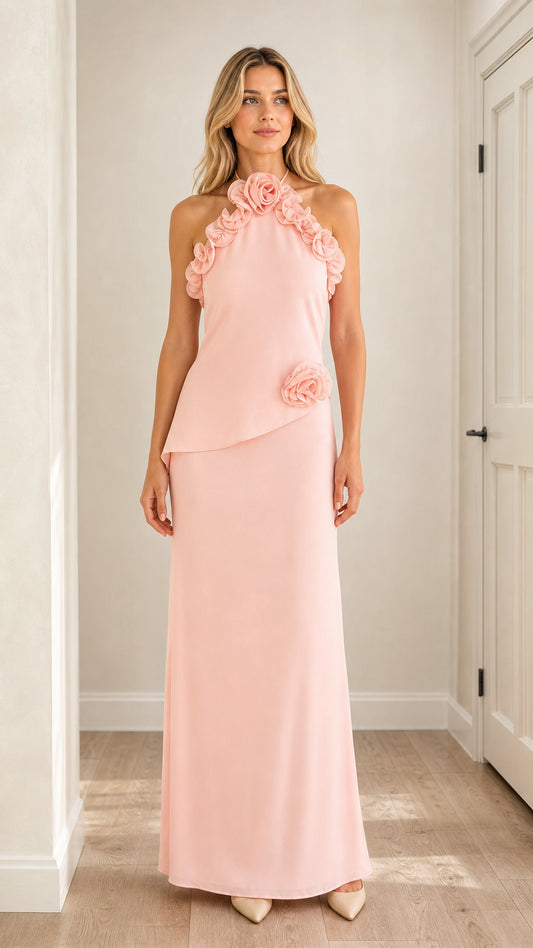 Front view of model wearing pink 3D floral halter maxi dress