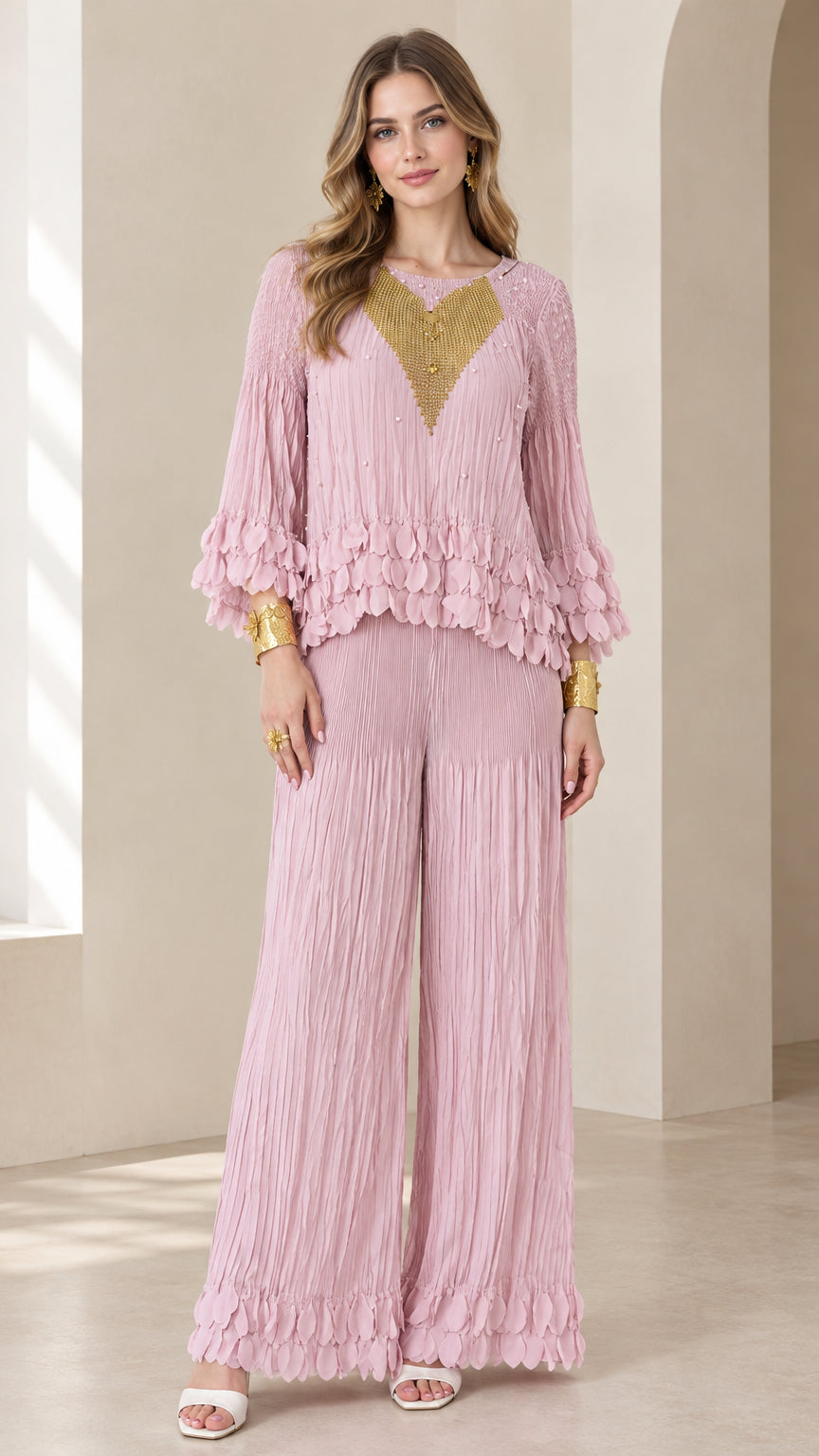 Front full view of woman wearing pink embroidered crinkle pleated two-piece pant set
