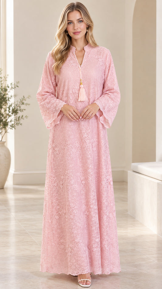 Front full view of woman wearing pink floral lace split-neck maxi dress with tassel