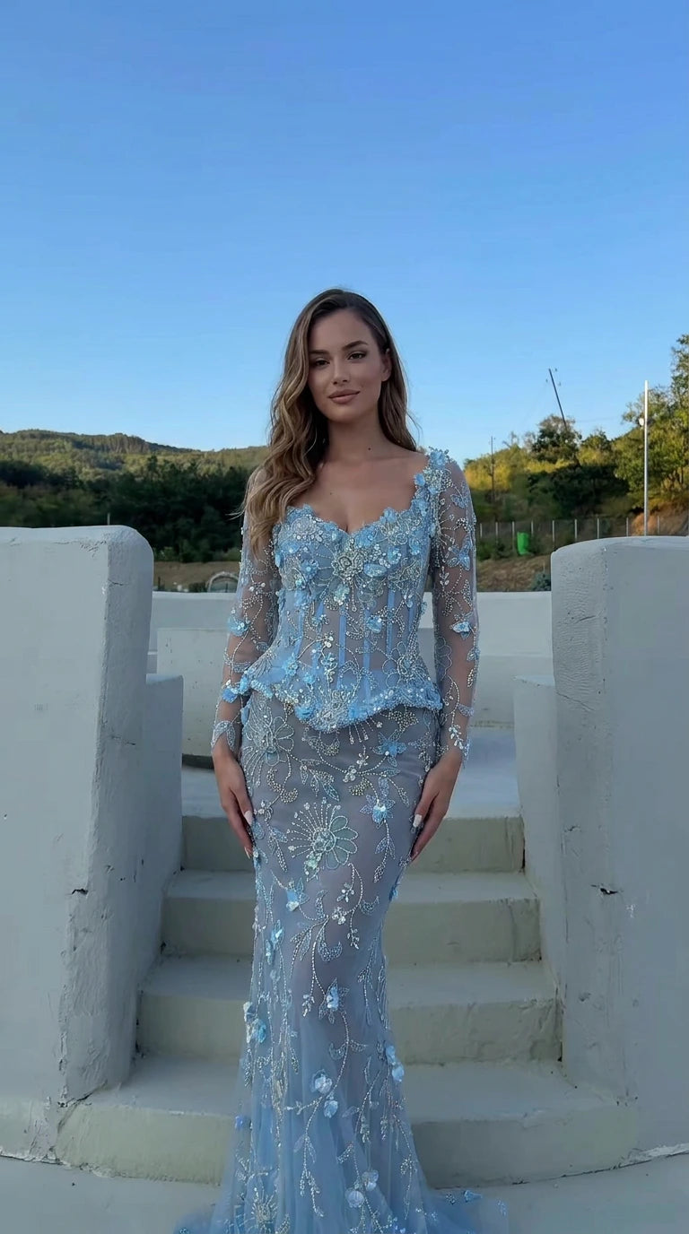 Front view of the floral appliqué corset peplum evening gown in light blue
