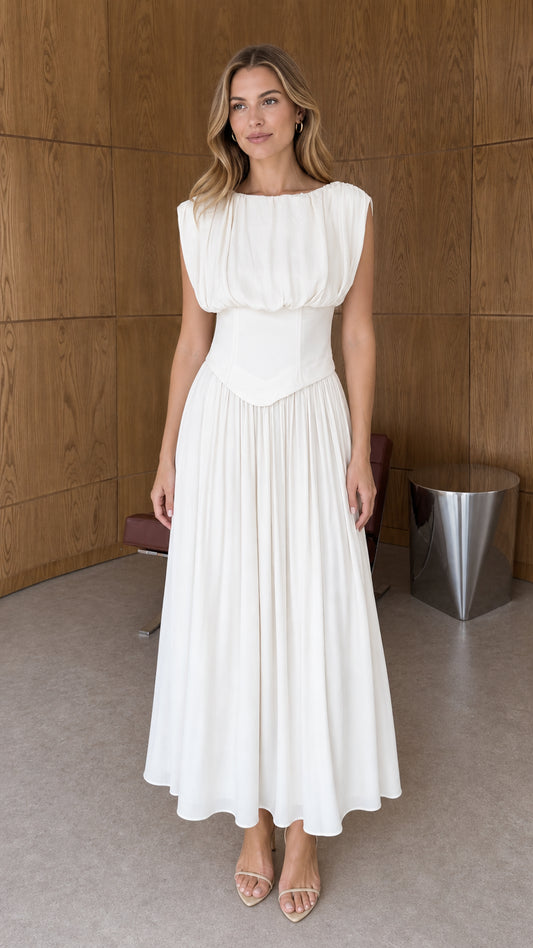 Front full-length view of woman wearing white sleeveless pleated basque waist midi dress