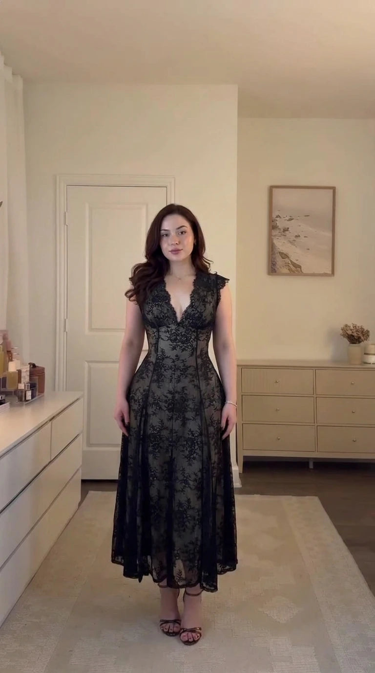Front full-length view of model wearing black floral lace corset midi dress