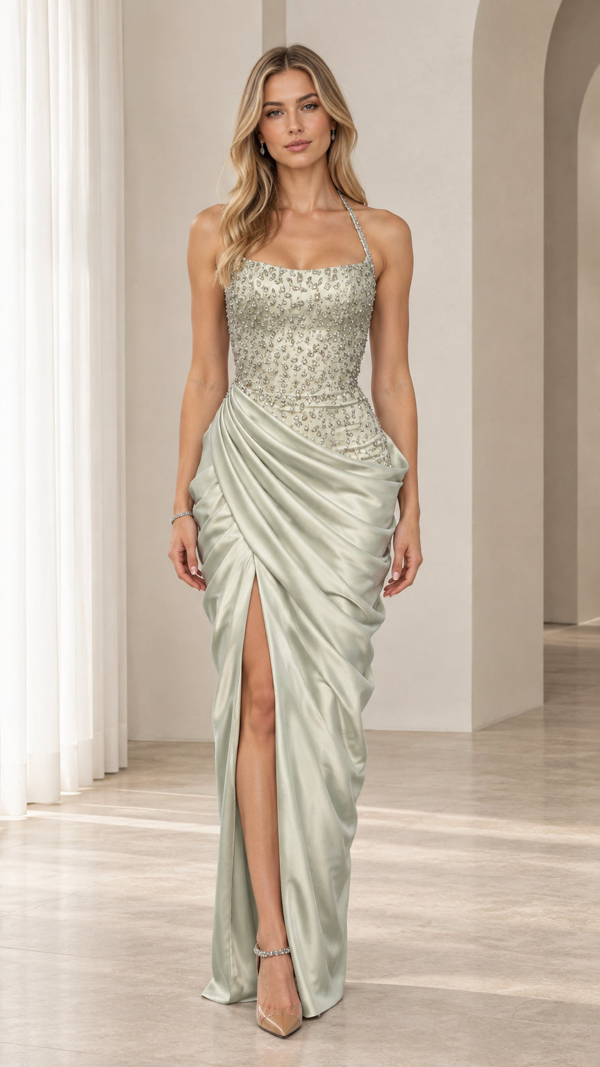 Front view of model wearing sage green beaded bodice draped satin maxi gown with slit