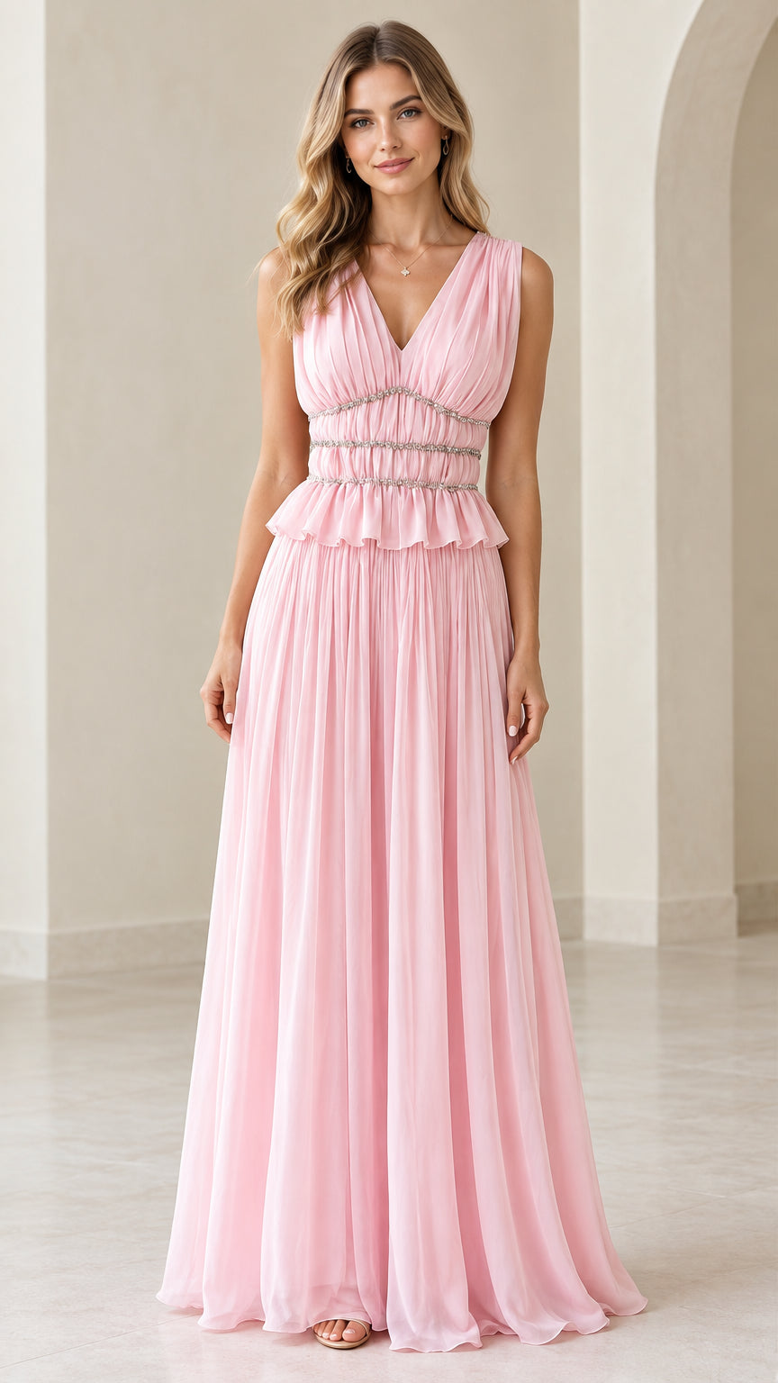 Front view of model wearing pink sleeveless pleated V-neck maxi dress with beaded waist