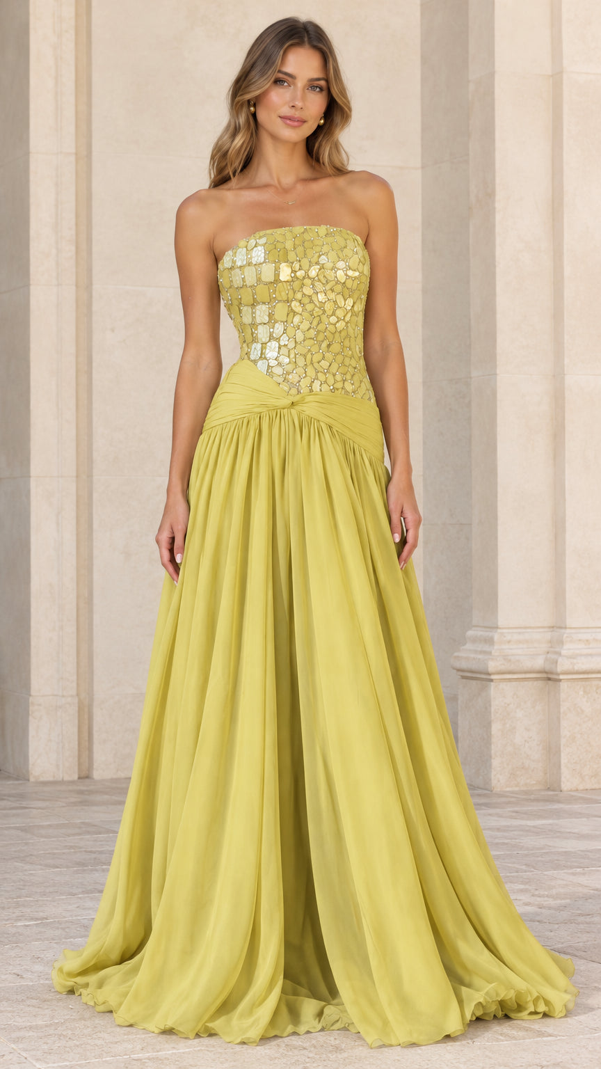 Front view of model wearing chartreuse strapless evening gown with embellished bodice