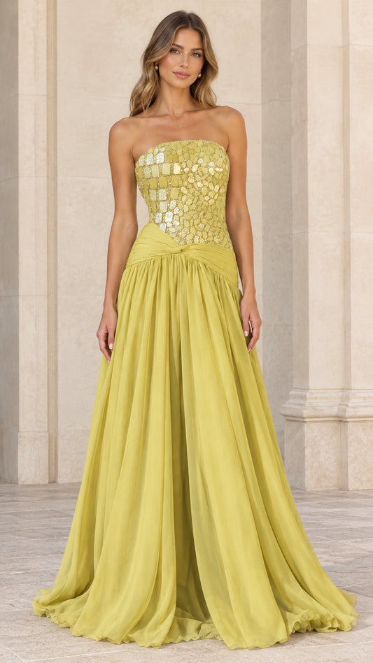 Front view of model wearing chartreuse strapless evening gown with embellished bodice