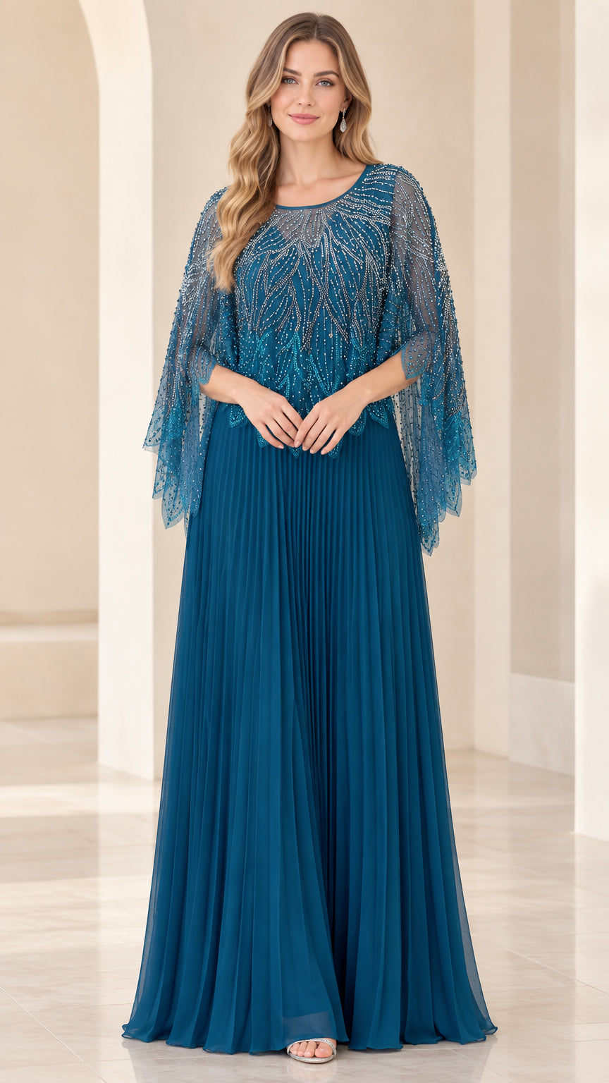 Front view of woman wearing teal blue beaded capelet pleated maxi evening gown