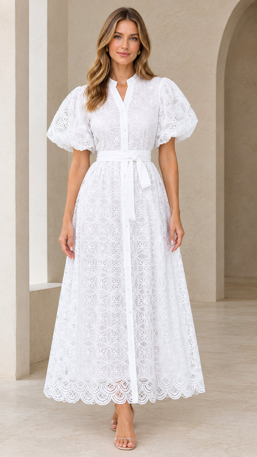 Front view of model wearing white puff sleeve eyelet lace belted maxi dress