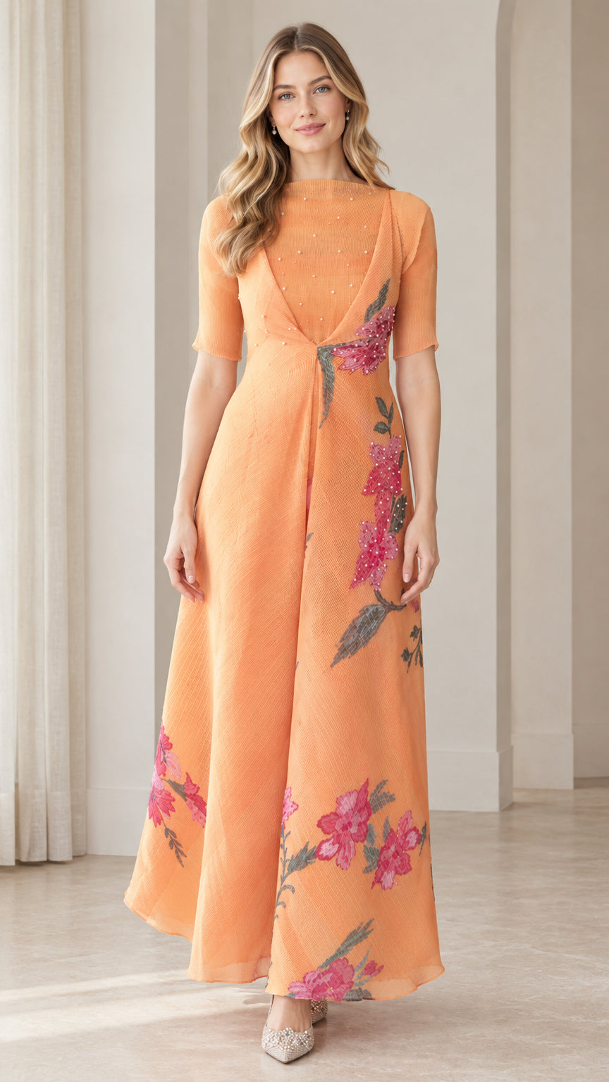 Front view of woman wearing apricot orange floral embroidered maxi dress with half sleeves
