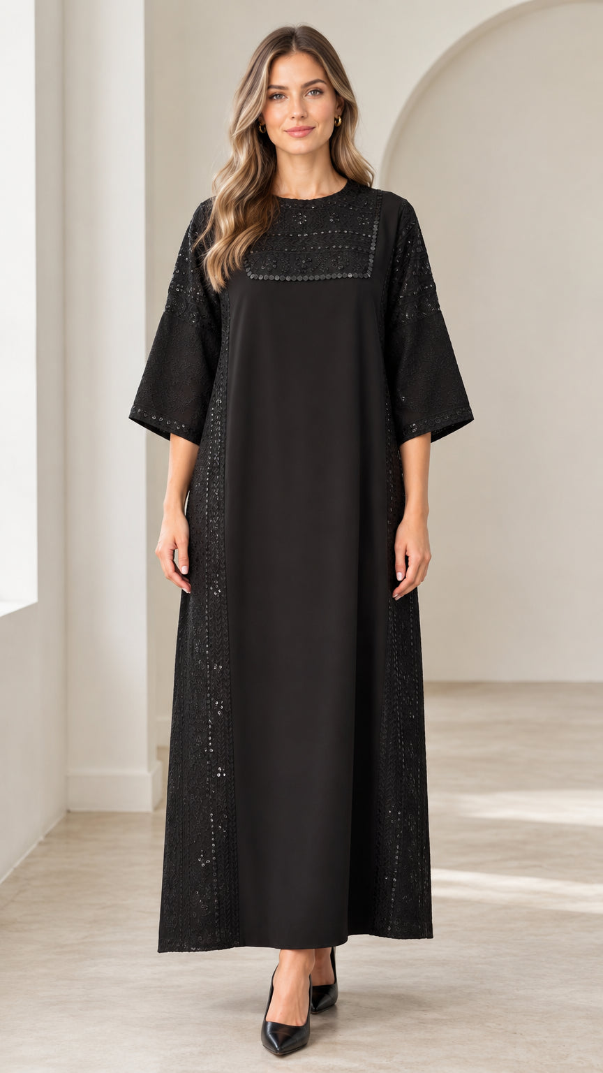 Front view of woman wearing black sequin embellished round neck maxi dress
