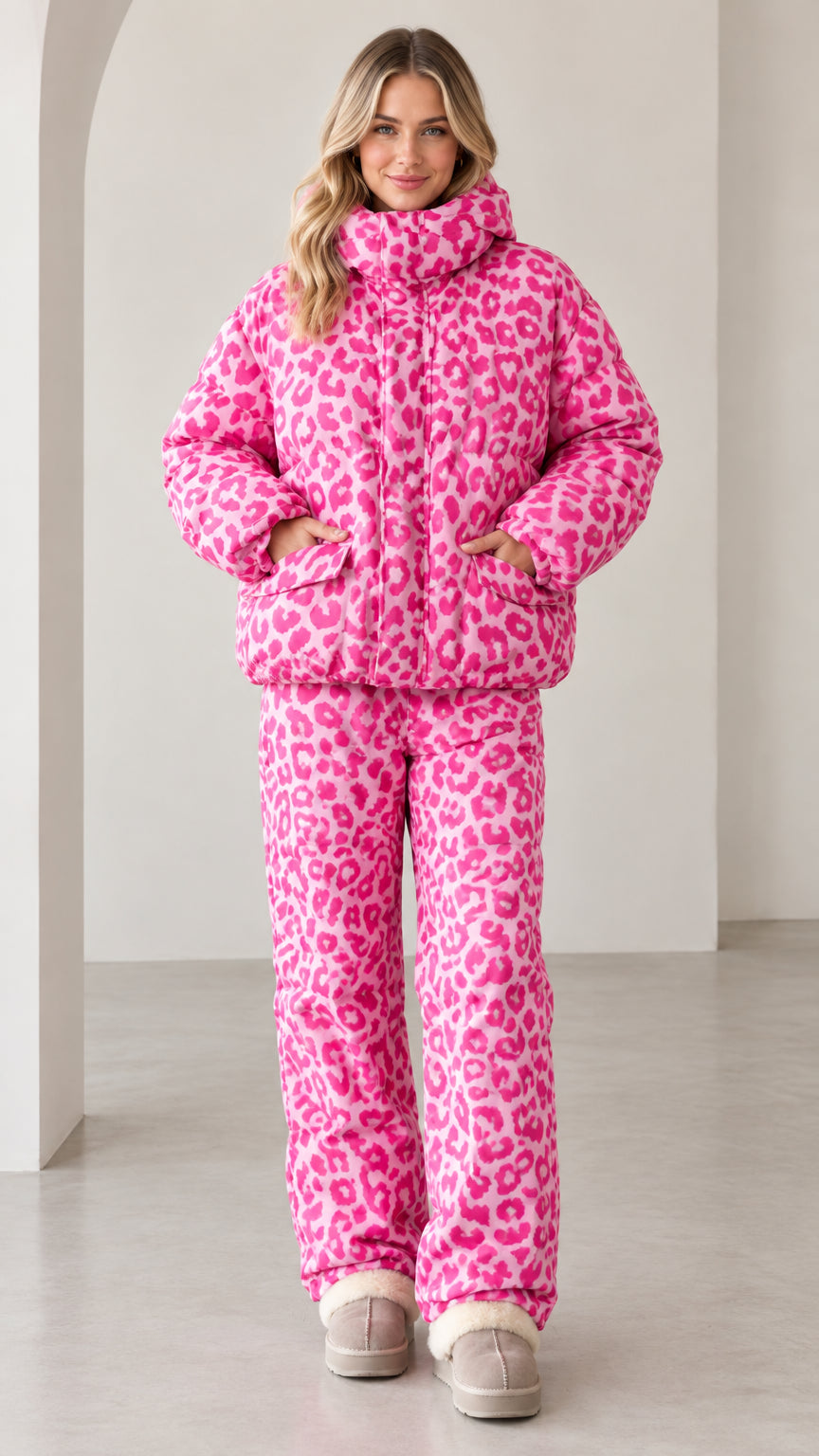 Full front view of model wearing pink leopard print puffer jacket and matching pants set