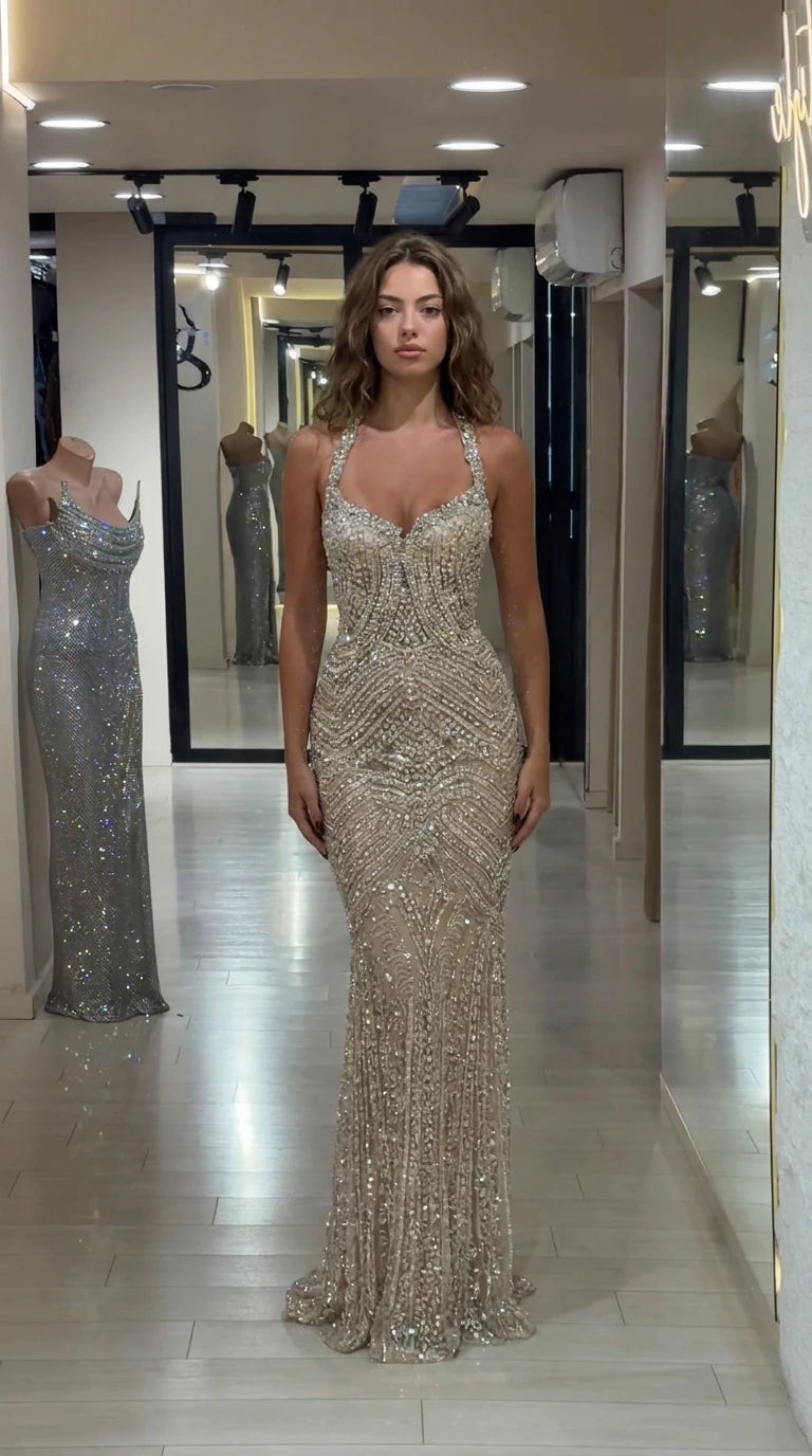 Front view of Champagne embellished halter sweetheart floor-length evening gown on model