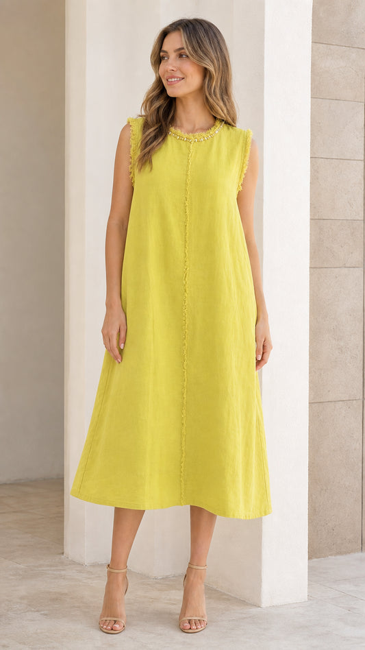 Front view of woman wearing chartreuse sleeveless midi dress with frayed trim