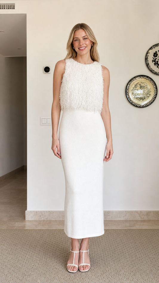 Model wearing white fringe textured sleeveless midi dress, front view
