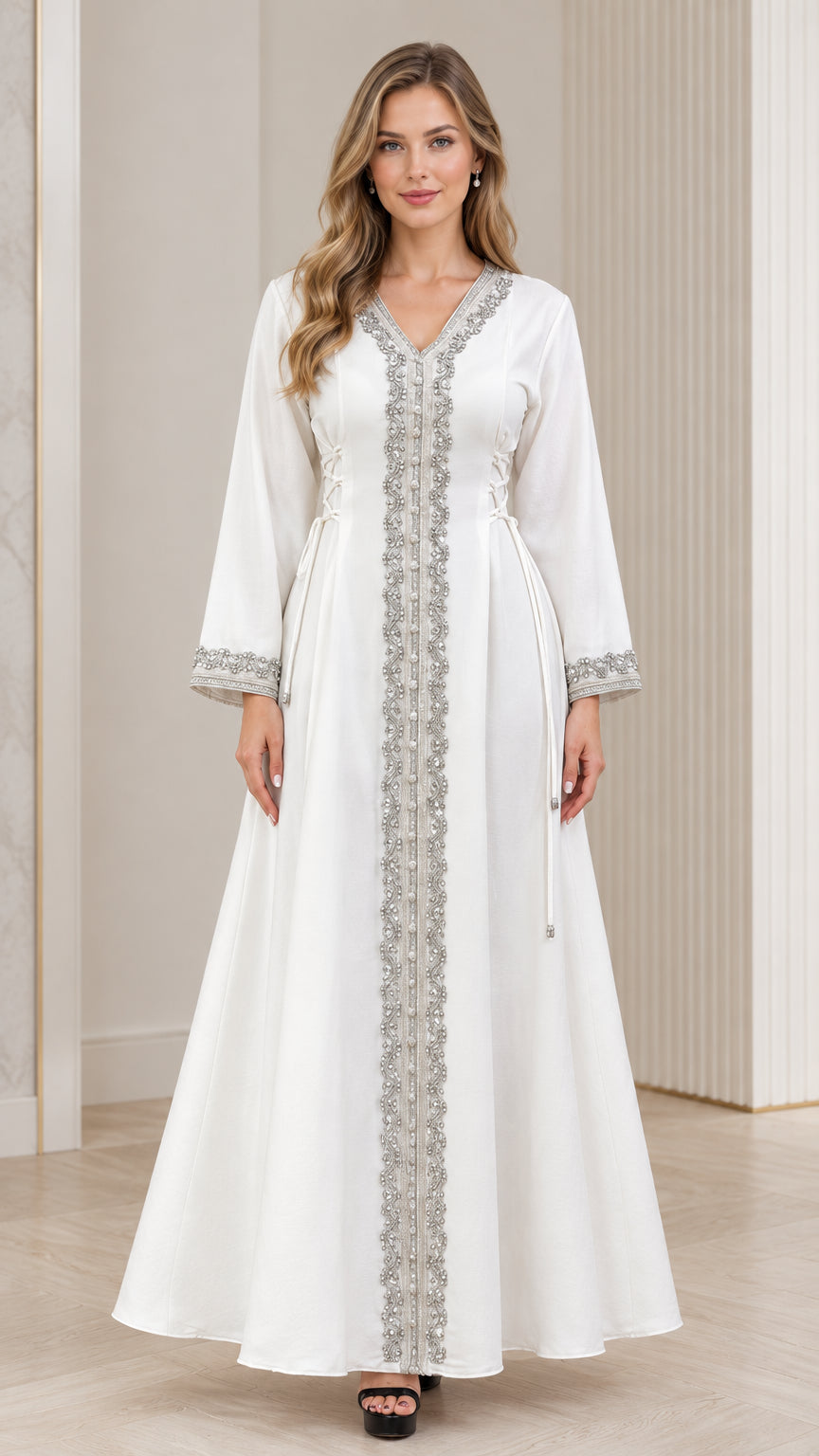 Front view of woman wearing white embroidered V-neck kaftan maxi dress with lace-up waist