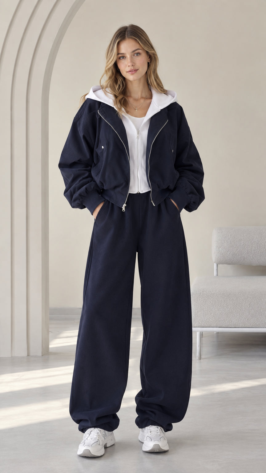 Front view of model wearing the Navy Blue contrast hooded jacket and wide-leg sweatpants set