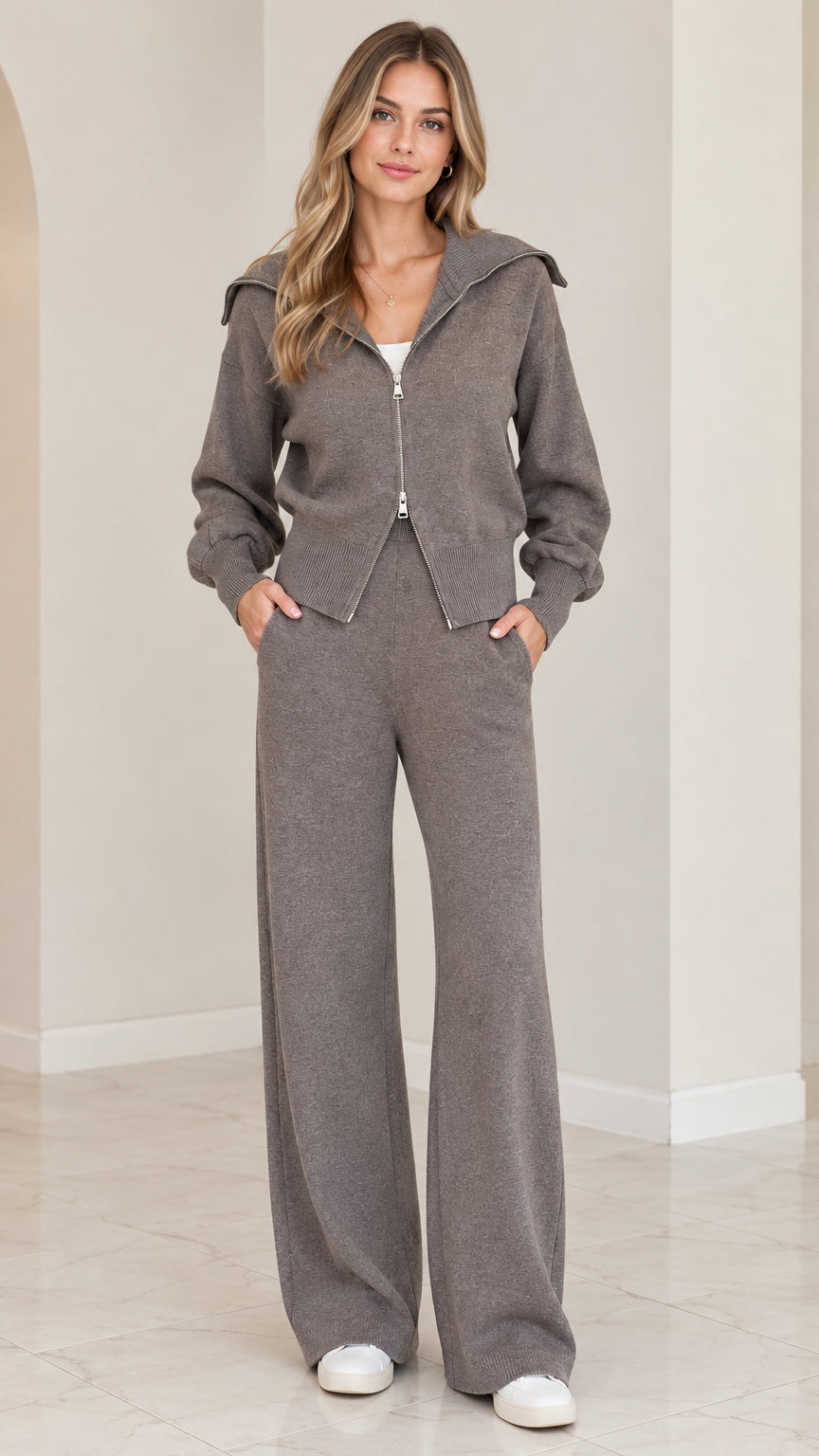 Front view of woman wearing charcoal grey 2-piece knit zip-up jacket and wide-leg loungewear set