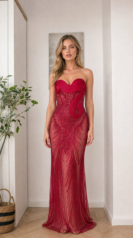 Front view of woman wearing red strapless beaded evening gown