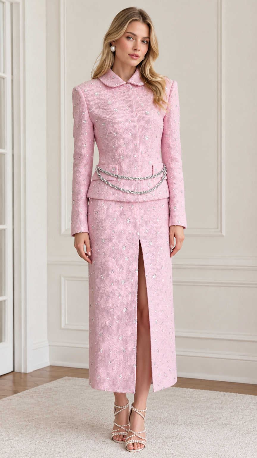 Front full-length view of model wearing pink rhinestone tweed blazer and front-slit skirt set