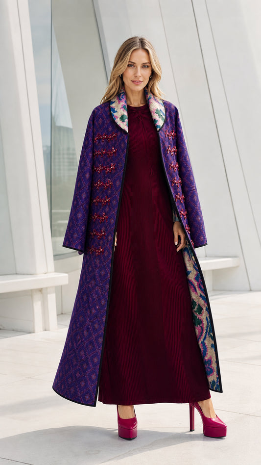 Front view of model wearing the purple quilted long coat