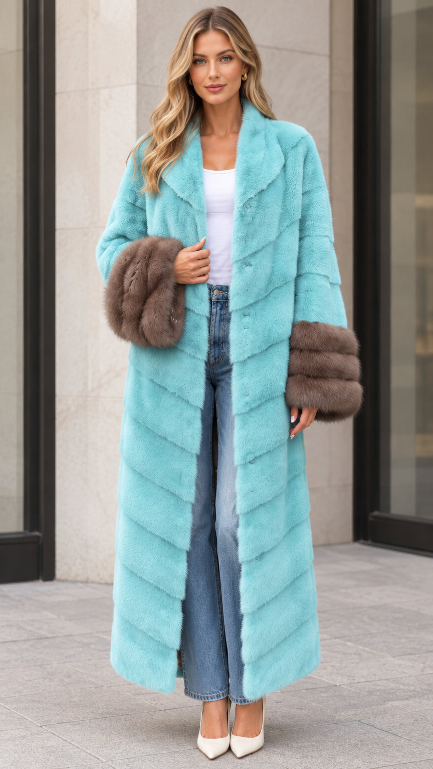 Front full-length view of woman wearing aqua blue chevron maxi faux fur coat with brown contrast cuffs