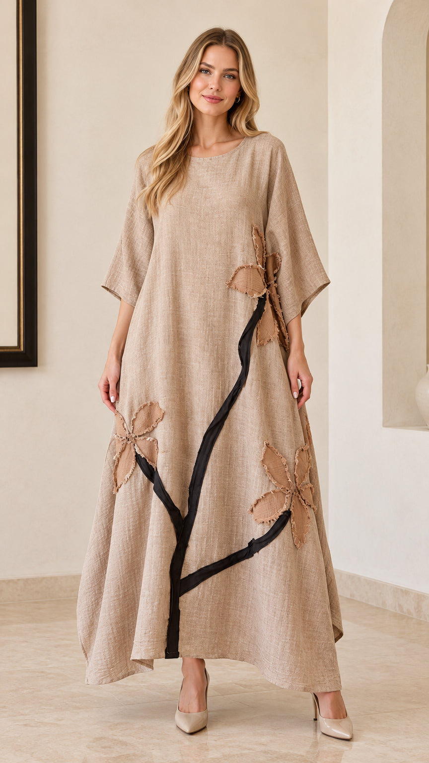 Front full view of woman wearing beige floral appliqué linen-look maxi dress