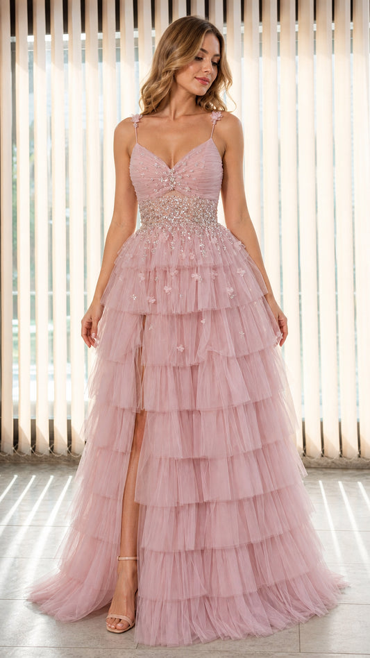 Model wearing Dusty Pink tiered tulle evening gown with beaded waist and high slit front view