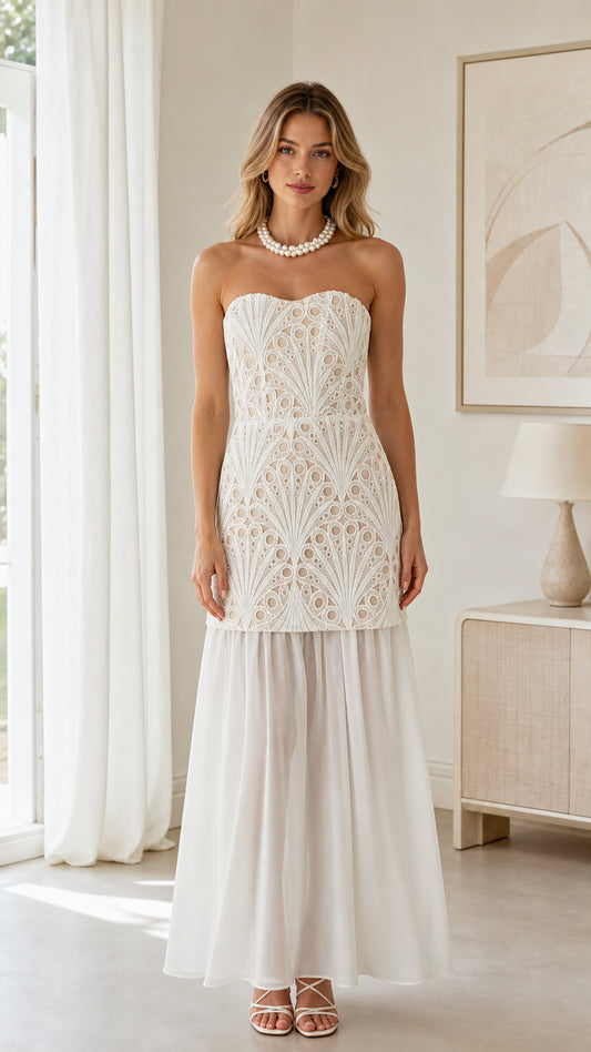 Model wearing white strapless embroidered lace drop waist maxi dress front view