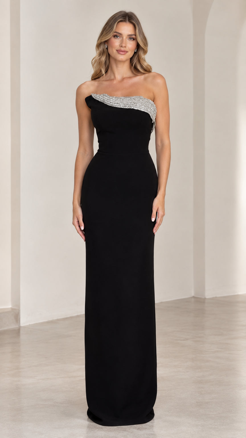 Front view of black strapless column evening gown with rhinestone trim