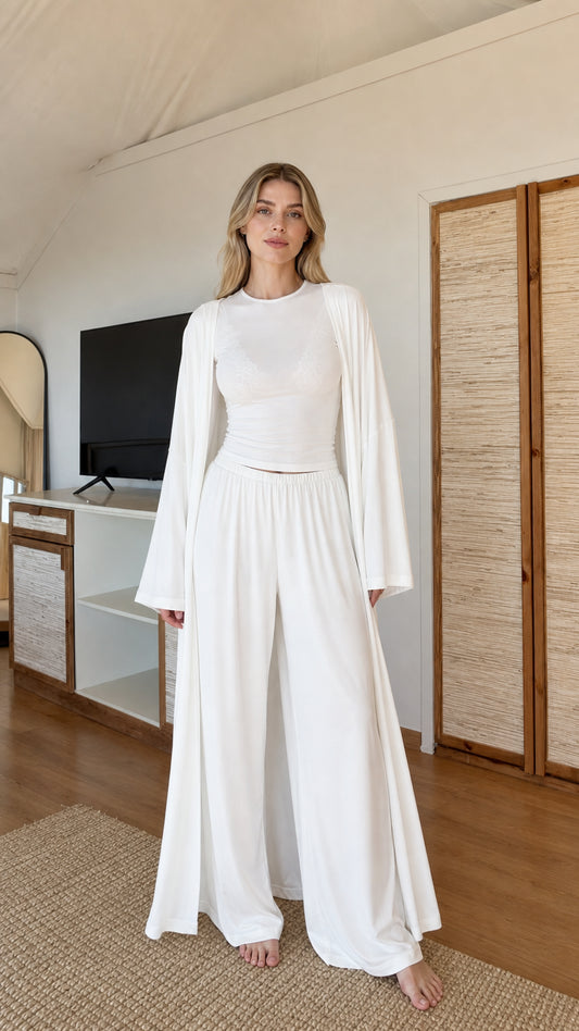 Front view of model wearing White 3-piece cardigan, fitted top, and wide-leg lounge pants set