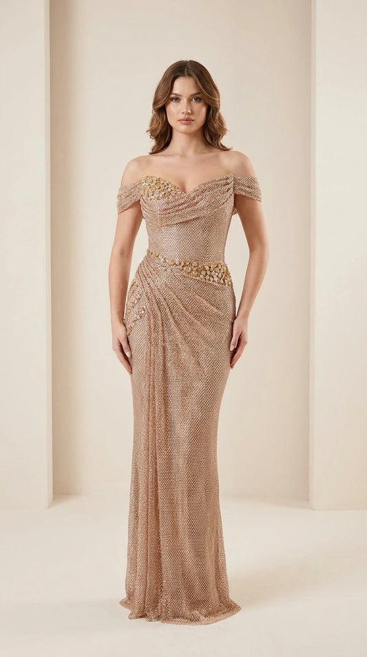 Front view of model wearing champagne off-shoulder beaded evening gown