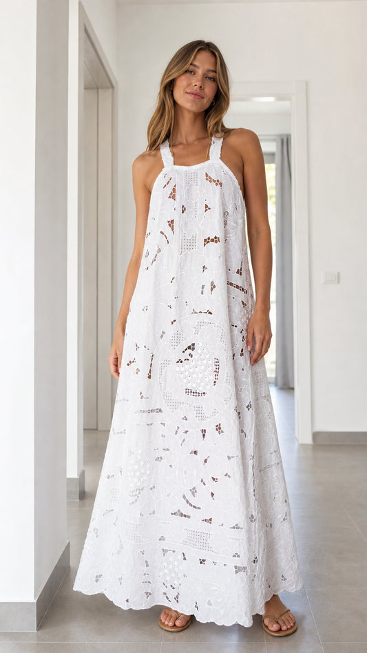 Front view of woman wearing white eyelet lace maxi dress