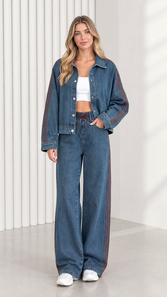Full front view of model wearing Classic Blue denim jacket and wide leg pants set with side stripe