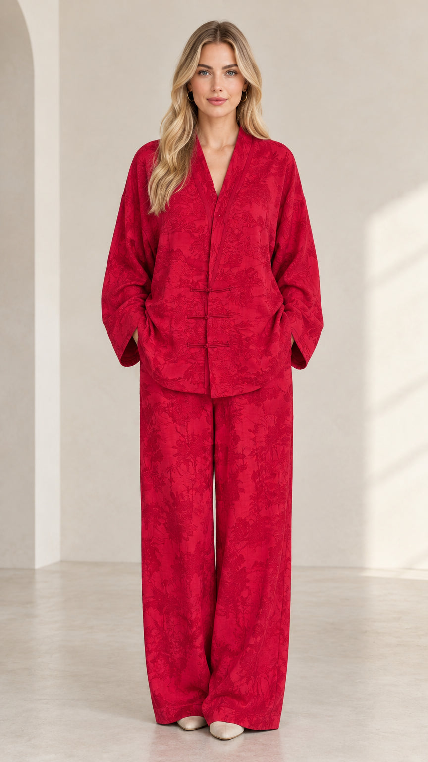 Full front view of women's red jacquard long sleeve top and wide-leg pants set
