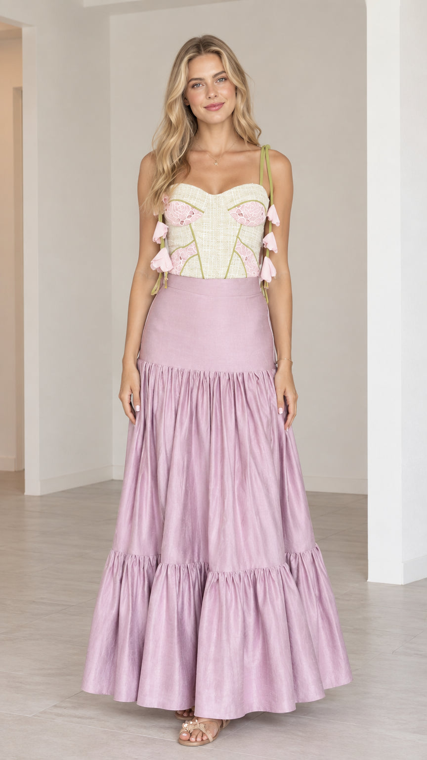 Lilac two-piece set featuring embroidered corset bustier and tiered maxi skirt front view