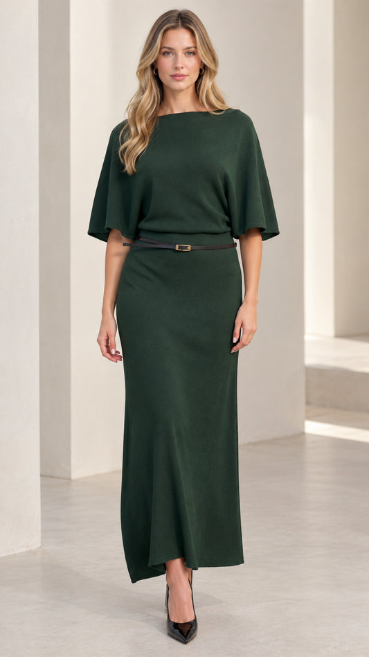 Front view of woman wearing elegant dark green knit maxi dress with flutter sleeves and belt