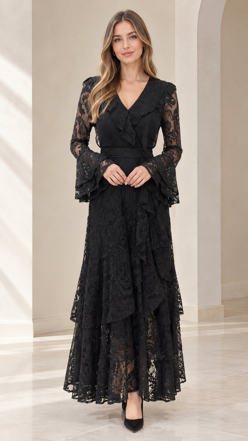 Front full view of woman wearing black tiered floral lace maxi dress with bell sleeves