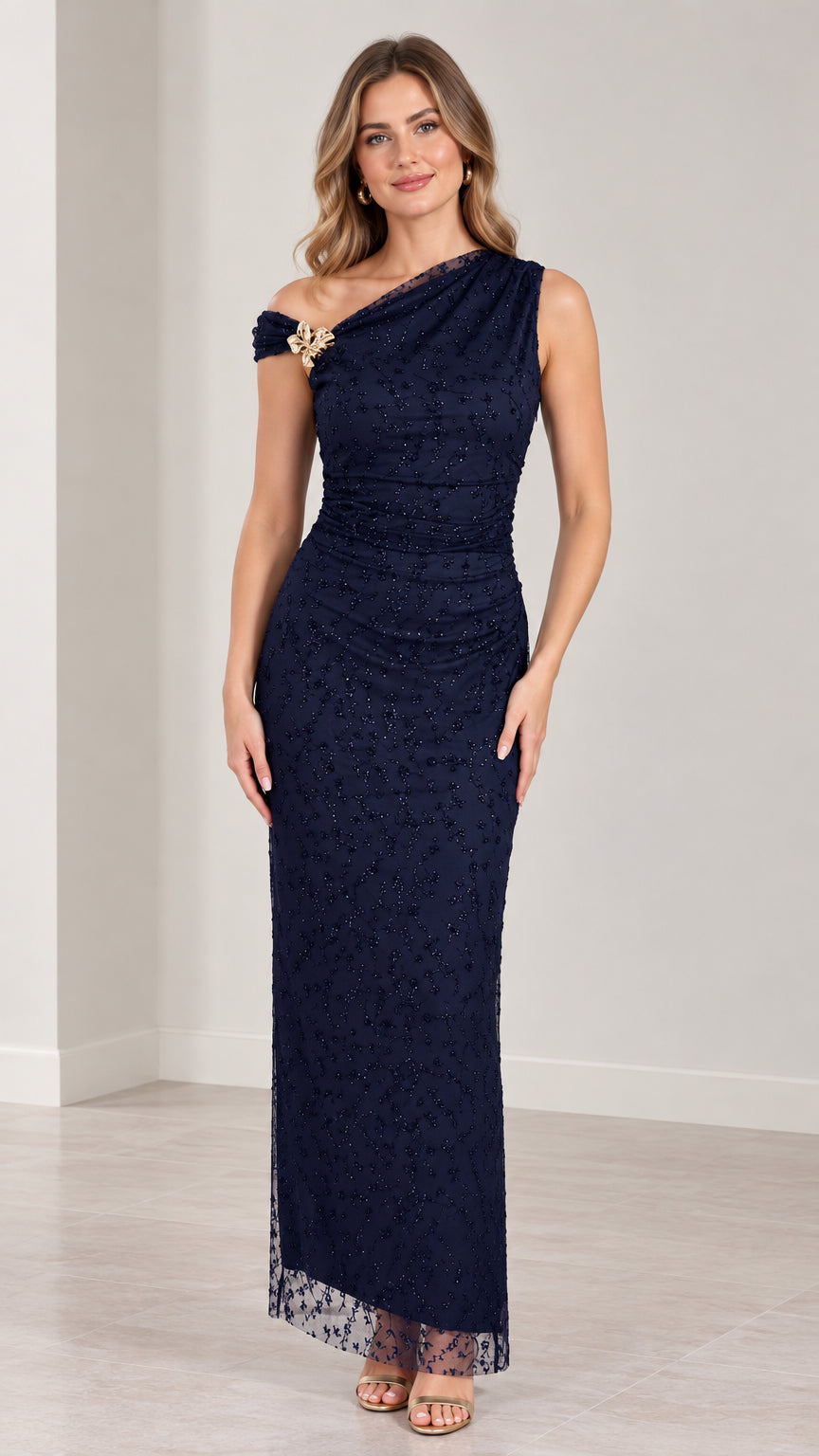 Full-length front view of navy blue one-shoulder beaded column evening gown with brooch