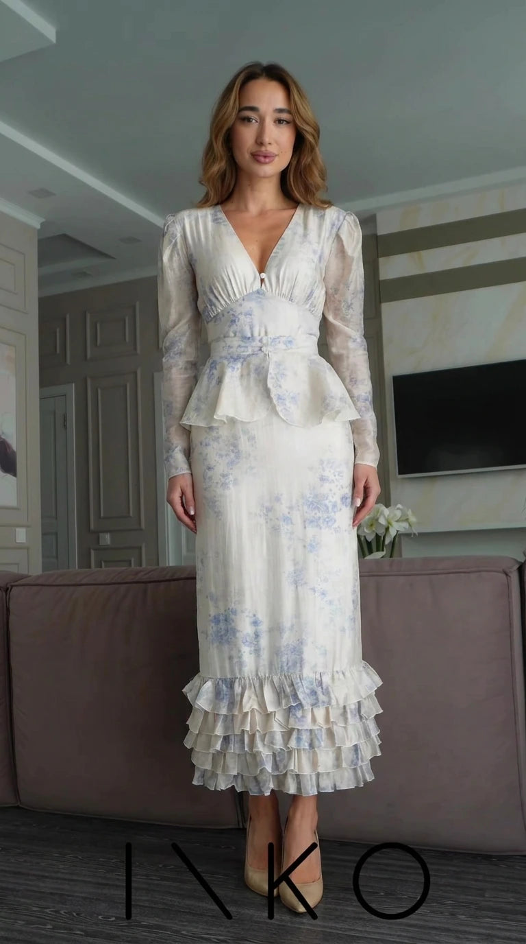 Front view of Ivory Blue floral print long sleeve peplum maxi dress with tiered ruffle hem