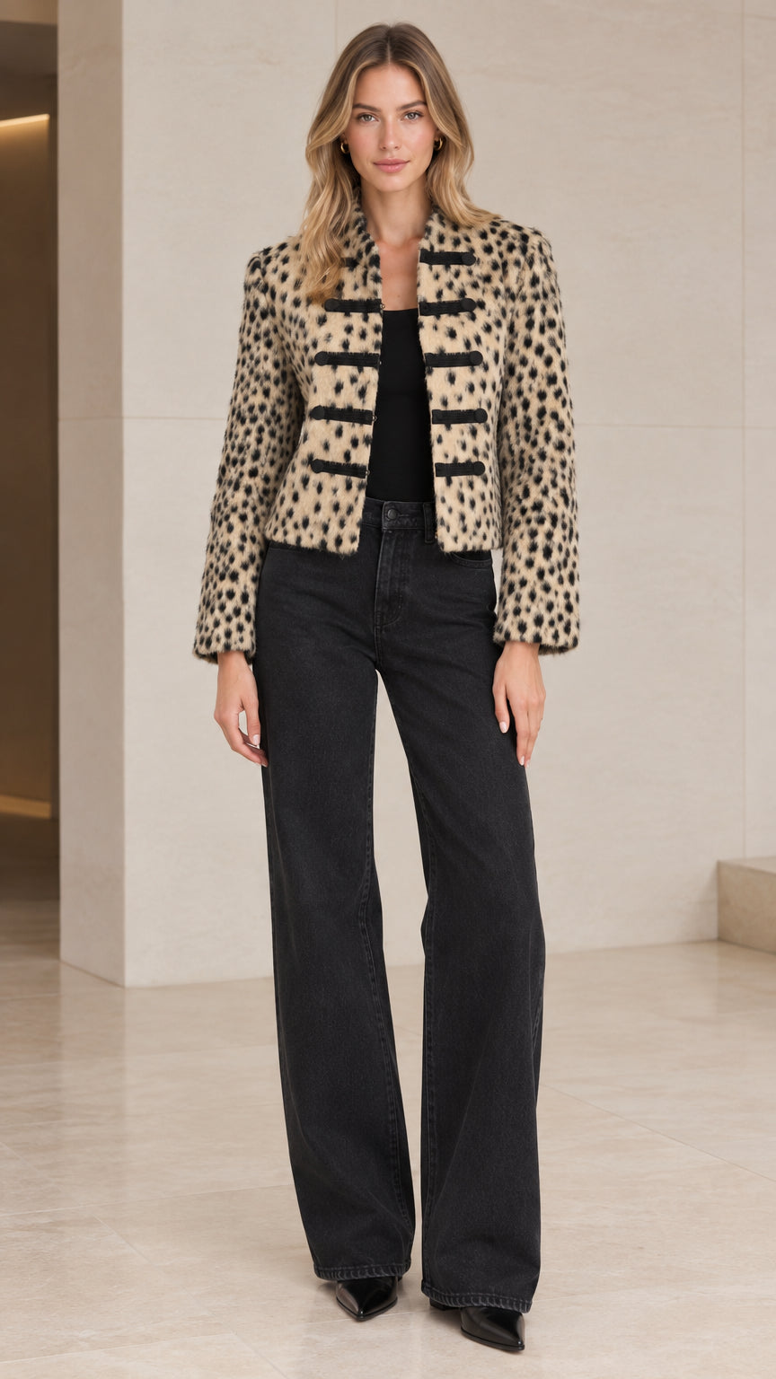 Front view of model wearing Beige Leopard cropped military jacket with dark wide-leg jeans