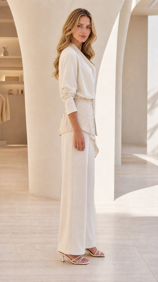 Side profile view of cream two-piece set